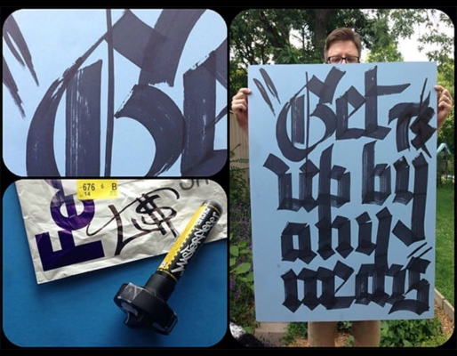 Terrance Weinzierl holding his creation from the Marker Challenge, a poster with the marker inked text, "Get up by any means".