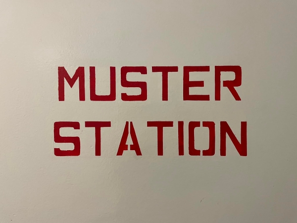 Signage on the GENCA cargo ship. "MUSTER STATION"