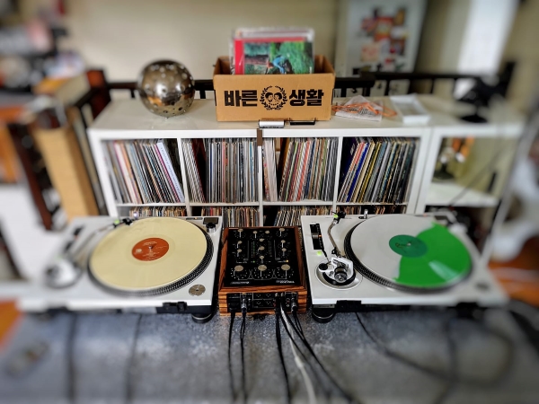 Spike’s vintage Technics, rotary mixer, and vinyl collection.