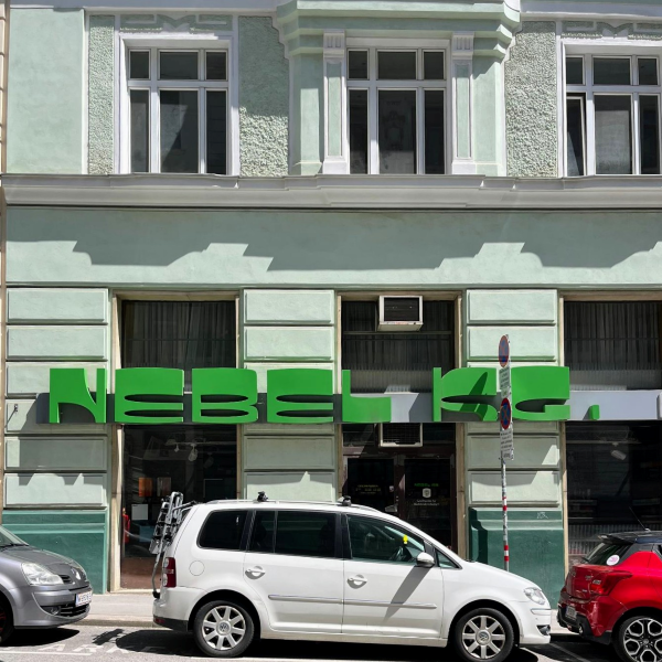 Green text example of interesting type on building in Vienna