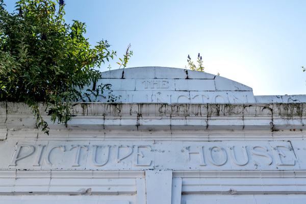 Stockport building with white carved text, including "PICTURE HOUSE."