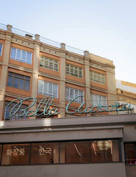 Bella Aurora in Eixample. "Bella Aurora" in a sweeping cursive font with Korean script on the window below.