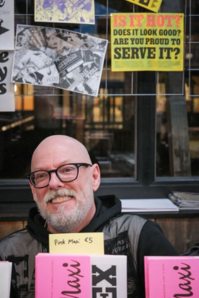 Dan Rhatigan pictured behind his table at the Brussels Ass Book Fair
