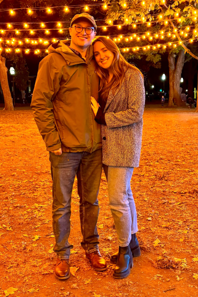Jake and his fiancée, Rachael, stand smiling together in front of twinkle-light-lined trees. Photo provided by Jake Murtaugh
