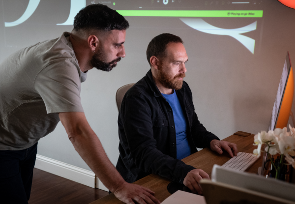 Resistenza Type Giuseppe and Paco at work in front of a computer. Photo by Luca Palmer.