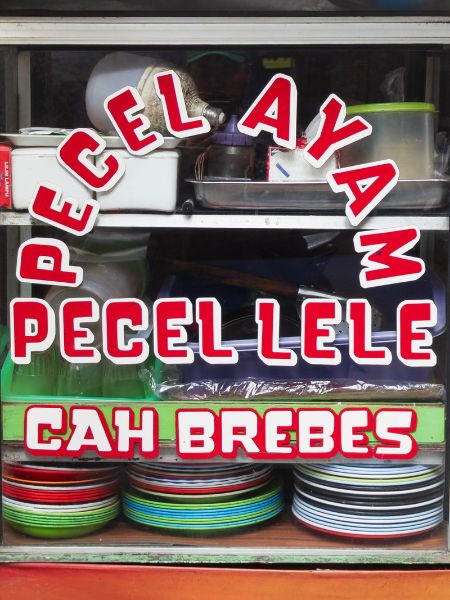 A window display featured handpainted vernacular signage in Jakarta