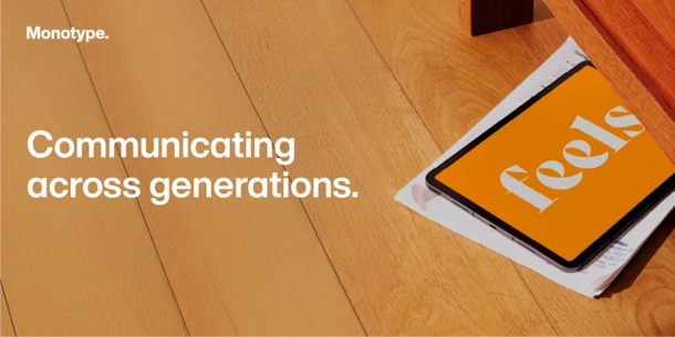 Communicating across generations hero image. Image of tablet and papers on wooden surface. Tablet orange background with white text: "feels." White text on wood background: "Communicating across generations."