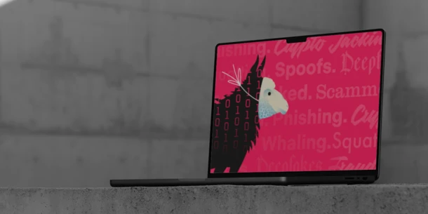 Image on a laptop of an illustration of a wolf wearing a sheep mask. Pink background with words like "deception," "scam," and "phishing" in various fonts.