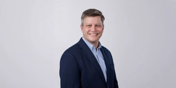 Terrance Weinzierl headshot with a grey background