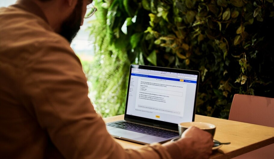 Man using Microsoft Word on Laptop